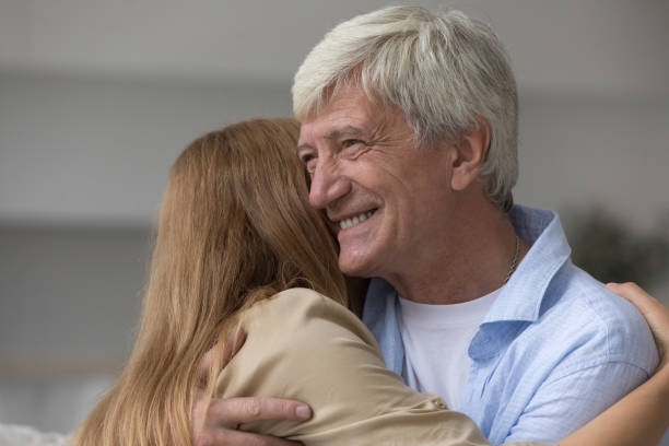 istock Loving daughter cuddling tightly hoary daddy, close up 2160836793