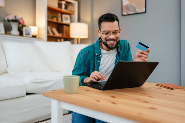 Handsome man enjoying in online shopping