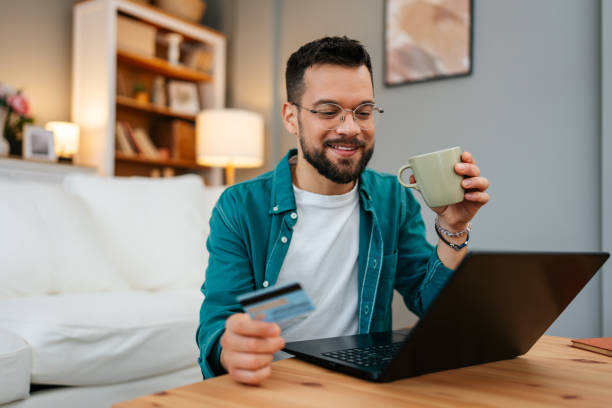 istock Handsome man enjoying in online shopping 2160838726