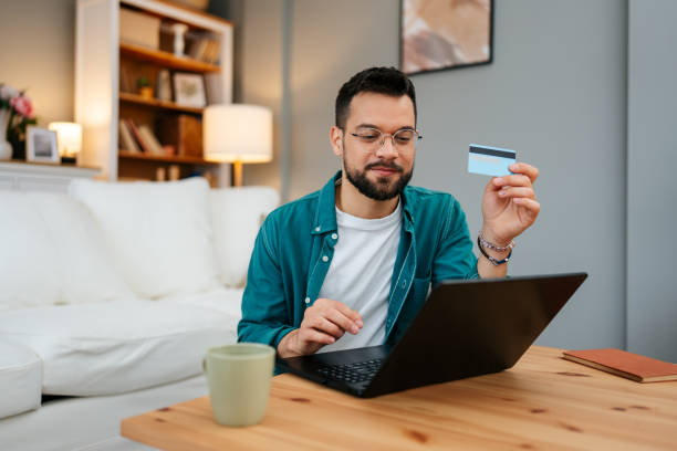 istock Handsome man enjoying in online shopping 2160838733