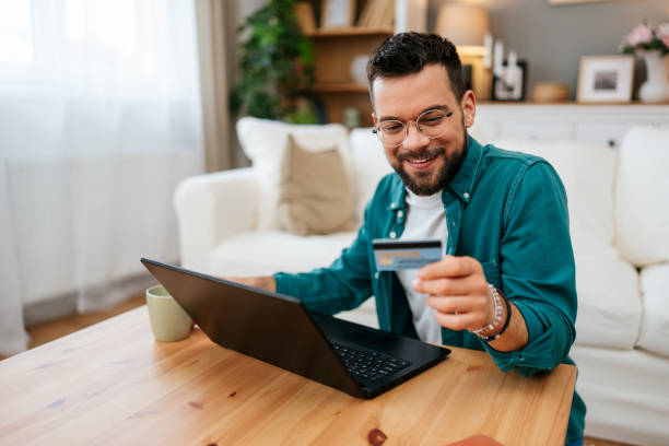 istock Handsome man enjoying in online shopping 2160838735