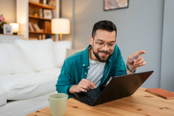istock Handsome man enjoying in online shopping 2160838743