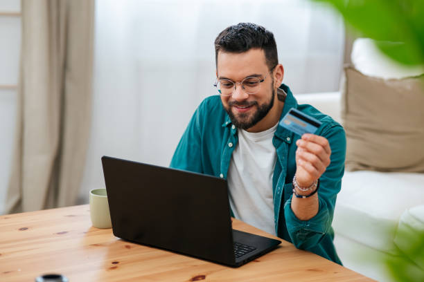 istock Handsome man enjoying in online shopping 2160838770