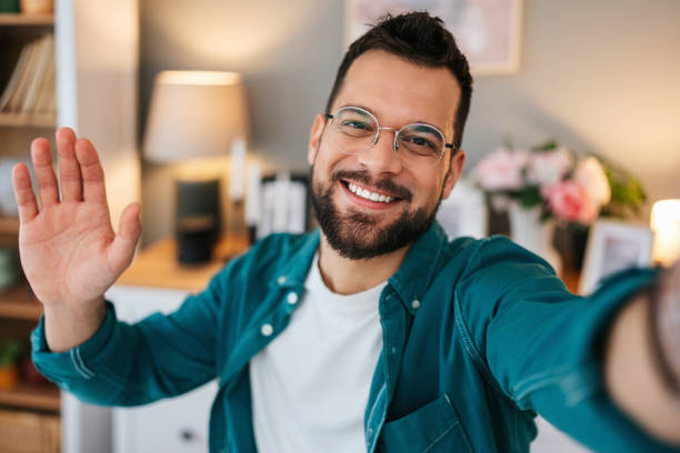 istock Handsome young man enjoying in video chat 2160838826