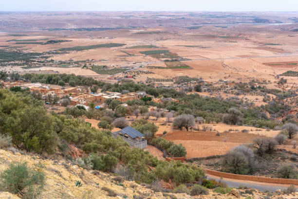 istock Arid Moroccan landscape near Marrakech, sparse vegetation, rolling hills, dry terrain, distant mountains 2160841945