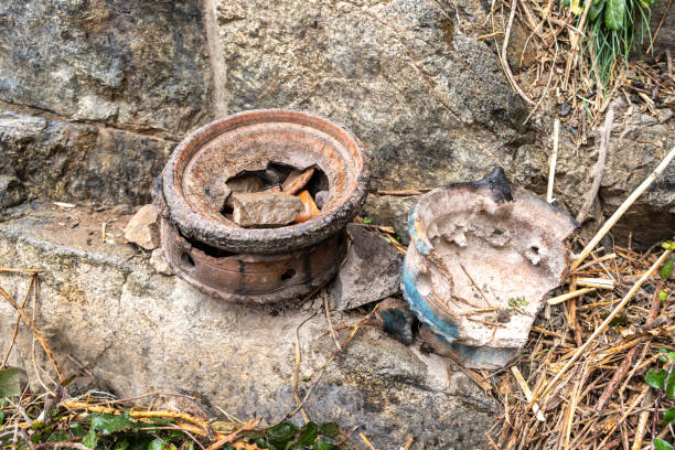 istock Old broken Moroccan tagines at tourist cafe, weathered pottery, rustic scene, scattered rocks 2160841952
