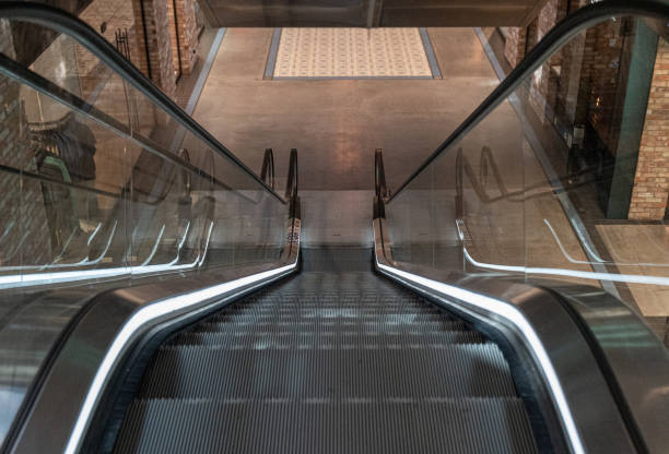 istock Escalator steps, moving staircase, empty metro elevator, electric stairway, metallic moving stairs 2160841981