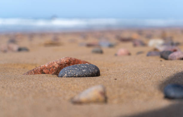 istock Colored Pebble Beach Texture Background, Sand and Rocky Shore Pattern, Red Morocco Beach, Africa 2160842400