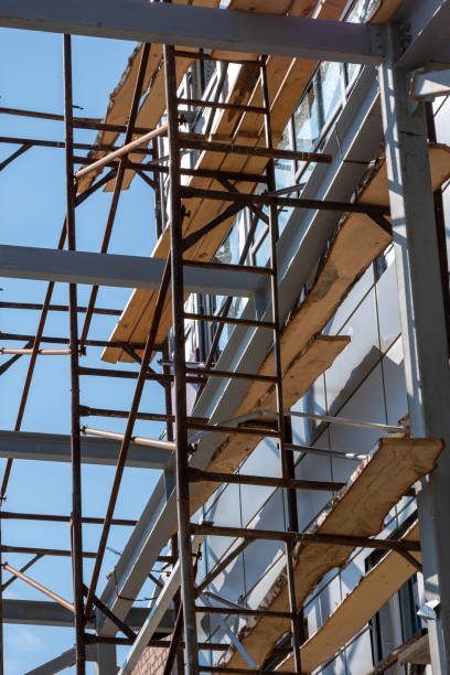 istock Building under construction with scaffolds. The process of renovating a new building. construction site 2160843563