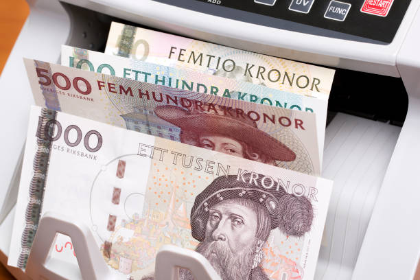 istock Swedish crown in the counting machine 2160844679