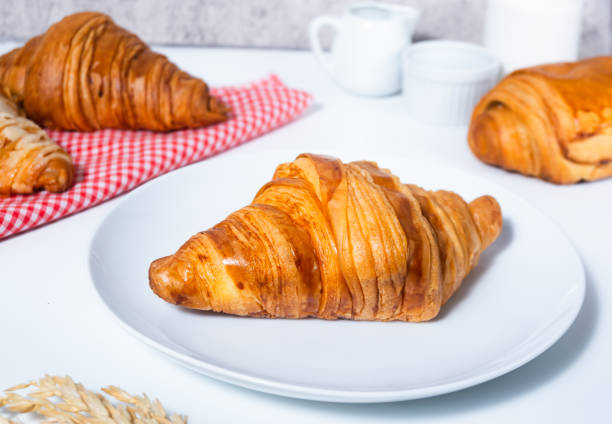 istock Croissant pastry on a white table. bright mood style. 2160847893