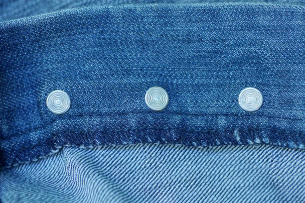istock gray white metal rivets on blue cotton fabric 2160851112