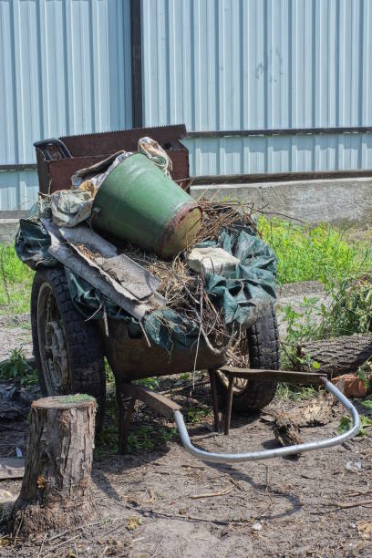 istock one brown iron rusty garden wheelbarrow full of garbage 2160851357