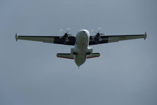 istock Twin-engine short-range transport aircraft in the cloudy sky. 2160854159