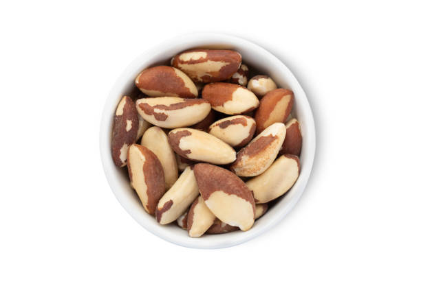 istock Bowl with exotic brazil nuts isolated on white background.Top view. 2160855462
