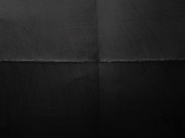 istock digital macro photo of paper with dark printer ink on it. test print with deep folding marks. 2160856969