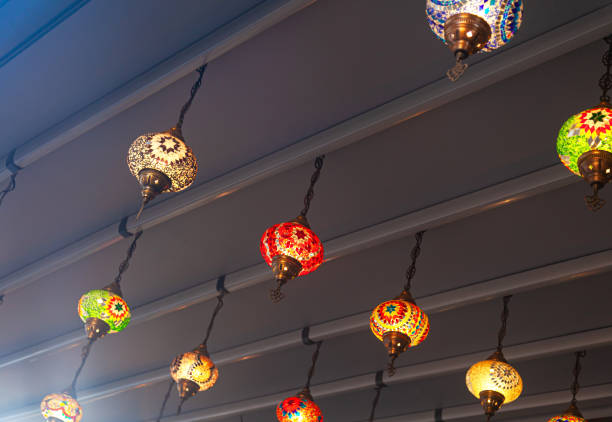 Oriental glowing chandeliers hanging from the ceiling.