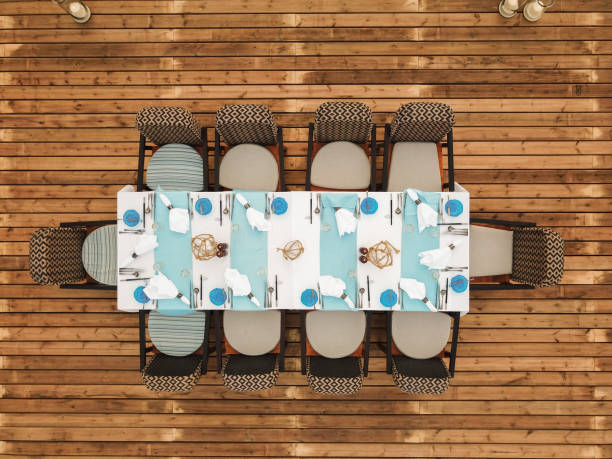 istock Garden Party Table with place settings for summer barbecue dinner event seen from above 2160865478