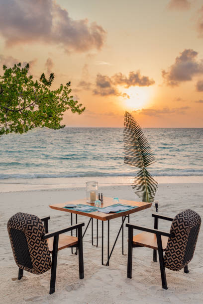 istock Romantic Sunset Beach Dinner Set up at Maldives island Resort 2160866451