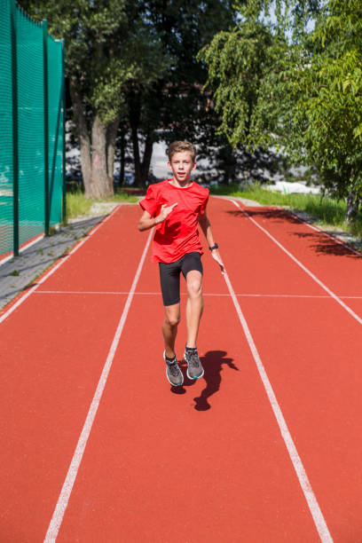 istock An athlete performs special running exercises at the stadium. 2160866519