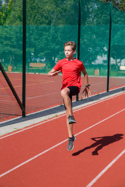 istock An athlete performs special running exercises at the stadium. 2160866520