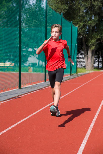 istock An athlete performs special running exercises at the stadium. 2160866521