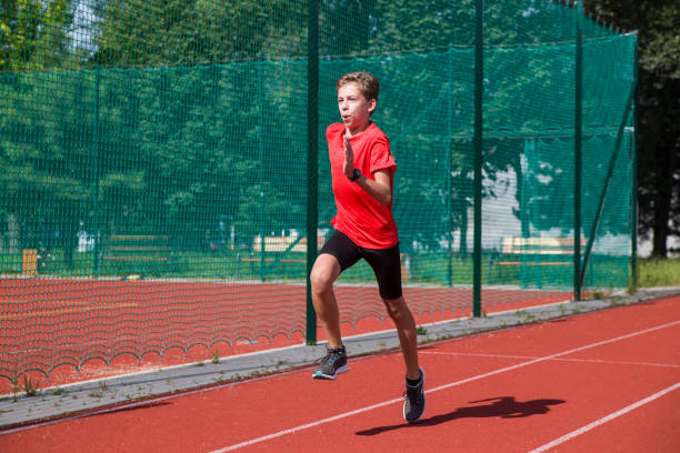 istock An athlete performs special running exercises at the stadium. 2160866522