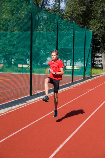 istock An athlete performs special running exercises at the stadium. 2160866525