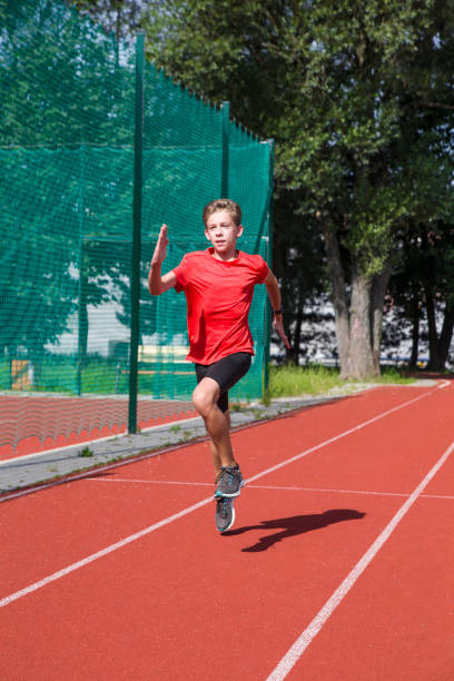 istock An athlete performs special running exercises at the stadium. 2160866526