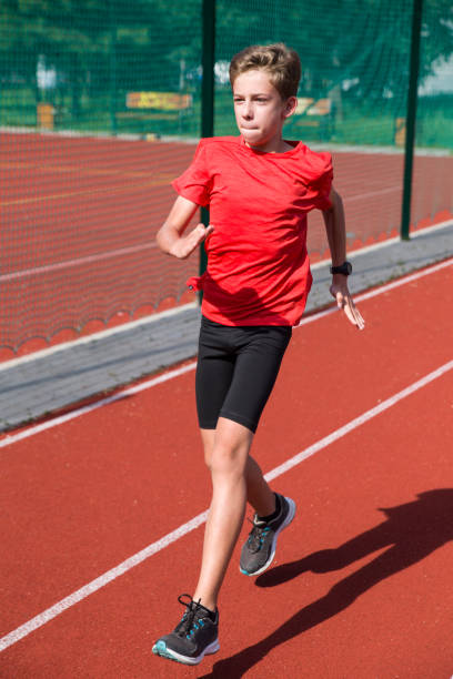 istock An athlete performs special running exercises at the stadium. 2160866527