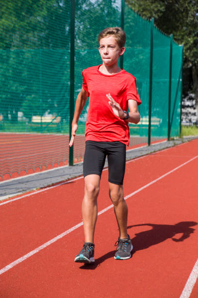 istock An athlete performs special running exercises at the stadium. 2160866528