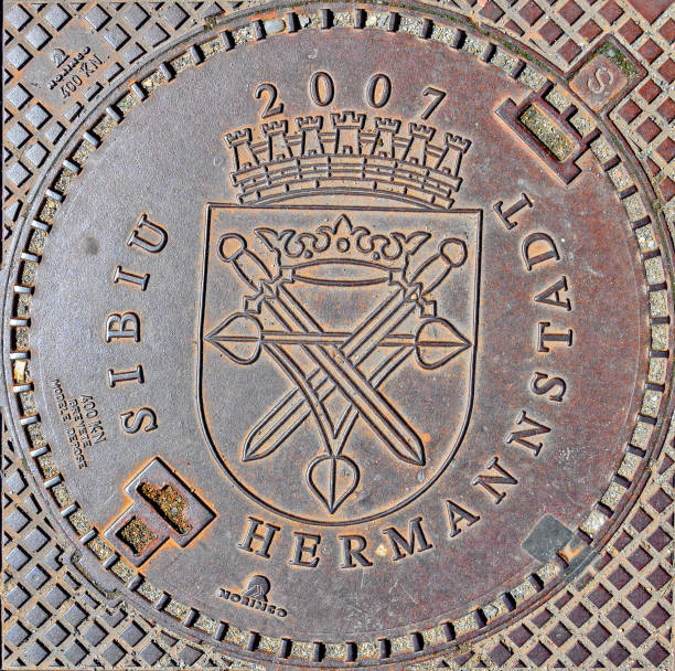 Iron cover with city arms of an entrance to the sewer system at Sibiu (Hermannstadt), Romania
