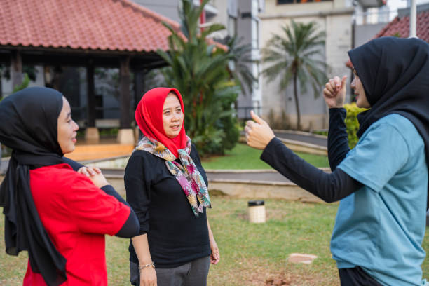 Yoga practice exercise class concept. Fitness women beginning yoga practice with private teacher on park. Working out with professional female yogi instructor. Healthy lifestyle in fitness club