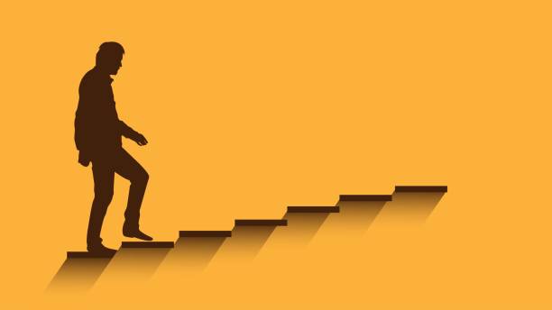 istock Silhouette of a Man Walking up the Stairs 2160878461