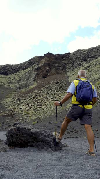 istock Senior man enjoying the volcanic landscape 2160880908