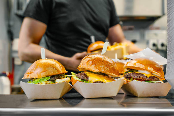 istock Delicious fresh hamburgers on display 2160882753