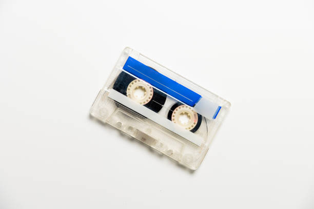 istock Audio cassette with black tape on a white background, top view. Template for inscription 2160888230