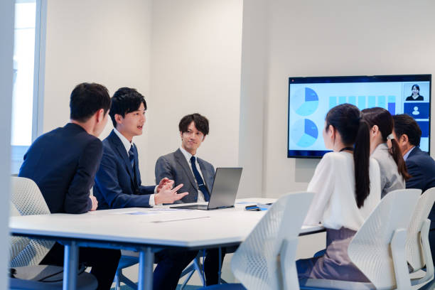 istock Young man in a suit speaking at a conference 2160904368
