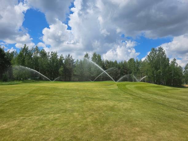 istock Sprinkler System Watering a Golf Course on a Sunny Day 2160908147
