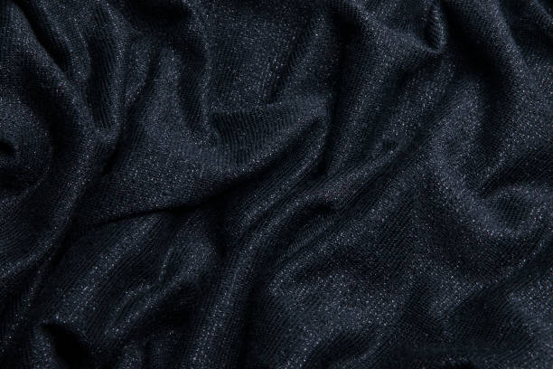 istock Smooth shiny fabric texture with folds and wawes. Close up silk background 2160908251