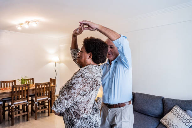 istock Senior couple dancing at home 2160908466