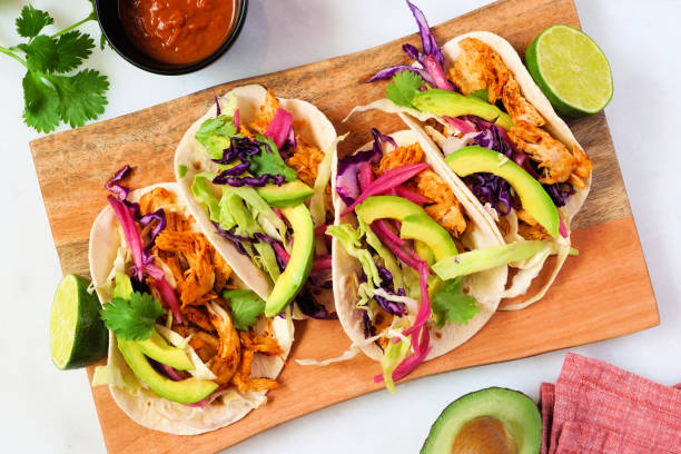 istock Chicken street tacos top view table scene with platter on a white marble background 2160908768