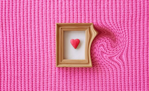 istock Heart-Shaped Cookie Postcard. Wooden Handmade Frame. Knitted Woolen Pink Background. Twist Effect 2160910015