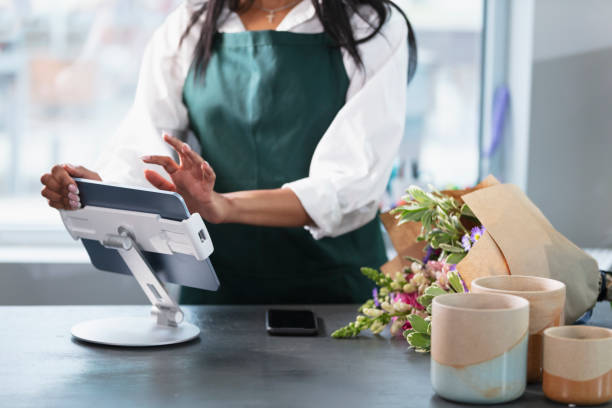istock Small business owner entering customer order on tablet 2160915100