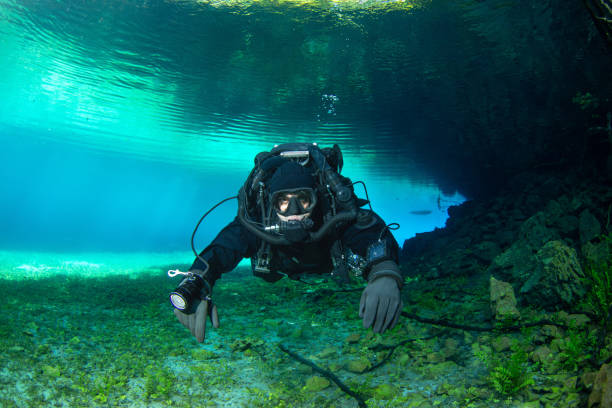 istock A diver using a rebreather is diving in a crystal clear water 2160916428
