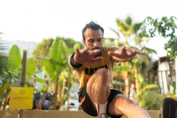 A man doing sports outdoors calisthenic movements in