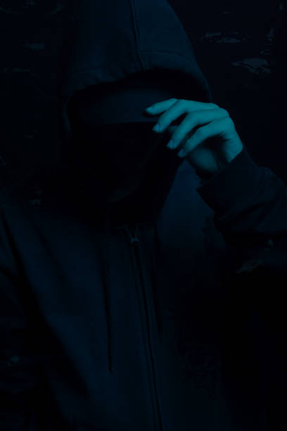 istock Young man wearing gray sweatshirt hiding his face. Studio portrait. 2160924999
