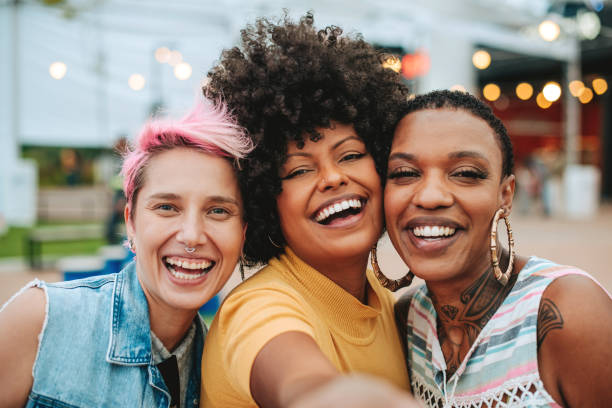 istock Three friends taking selfie with smartphone 2160926872