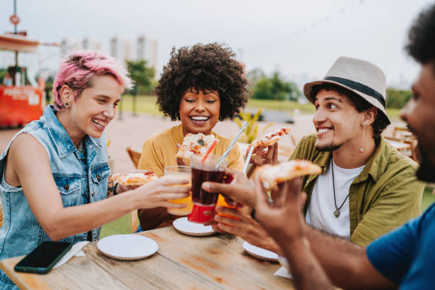 istock Group of friends at table toasting with drink 2160927032