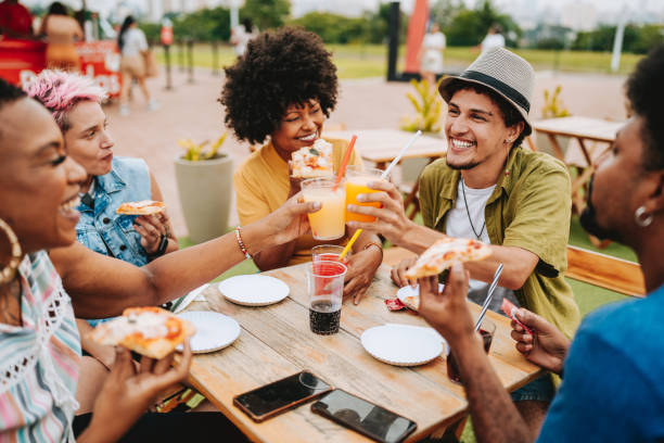 istock Group of friends at table toasting with drink 2160927035